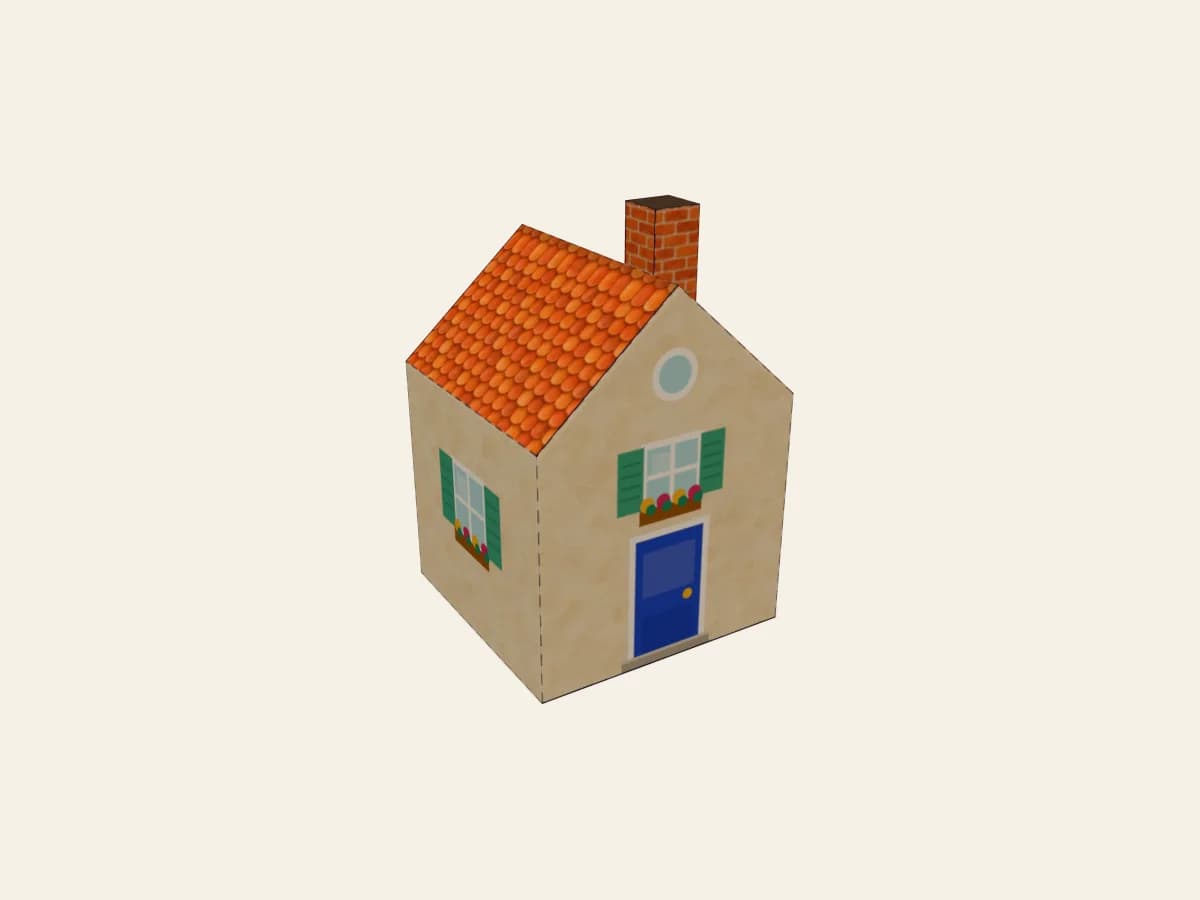 Maison miniature en papier montée, avec son toit et sa petite cheminée