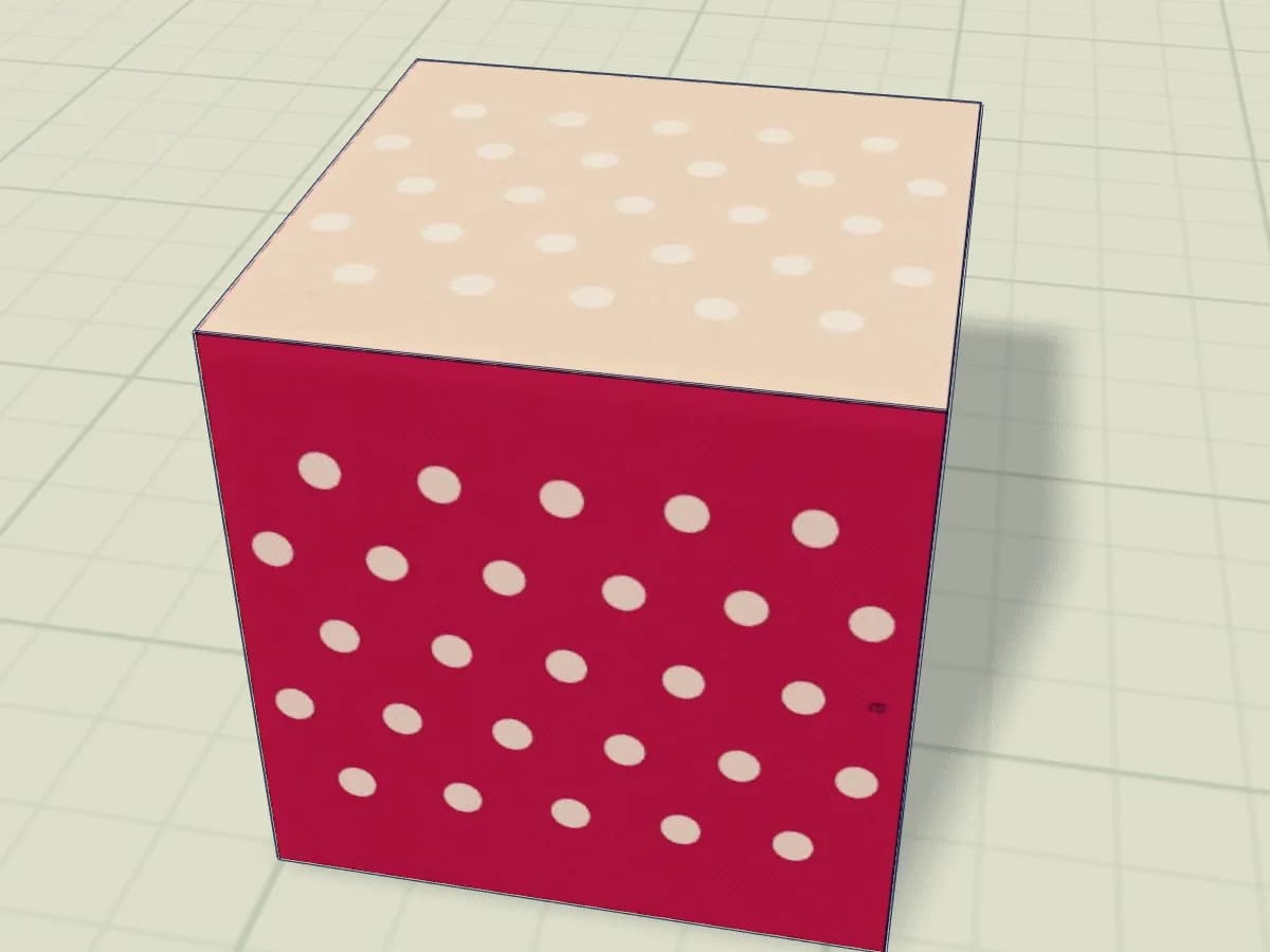 Boîte en papier en forme de cube avec son couvercle.