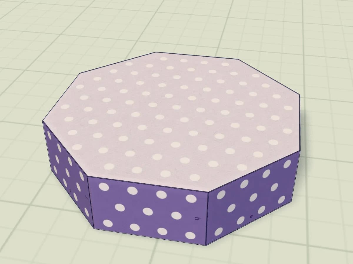 Boîte en papier avec huit faces latérales et un couvercle octogonal.