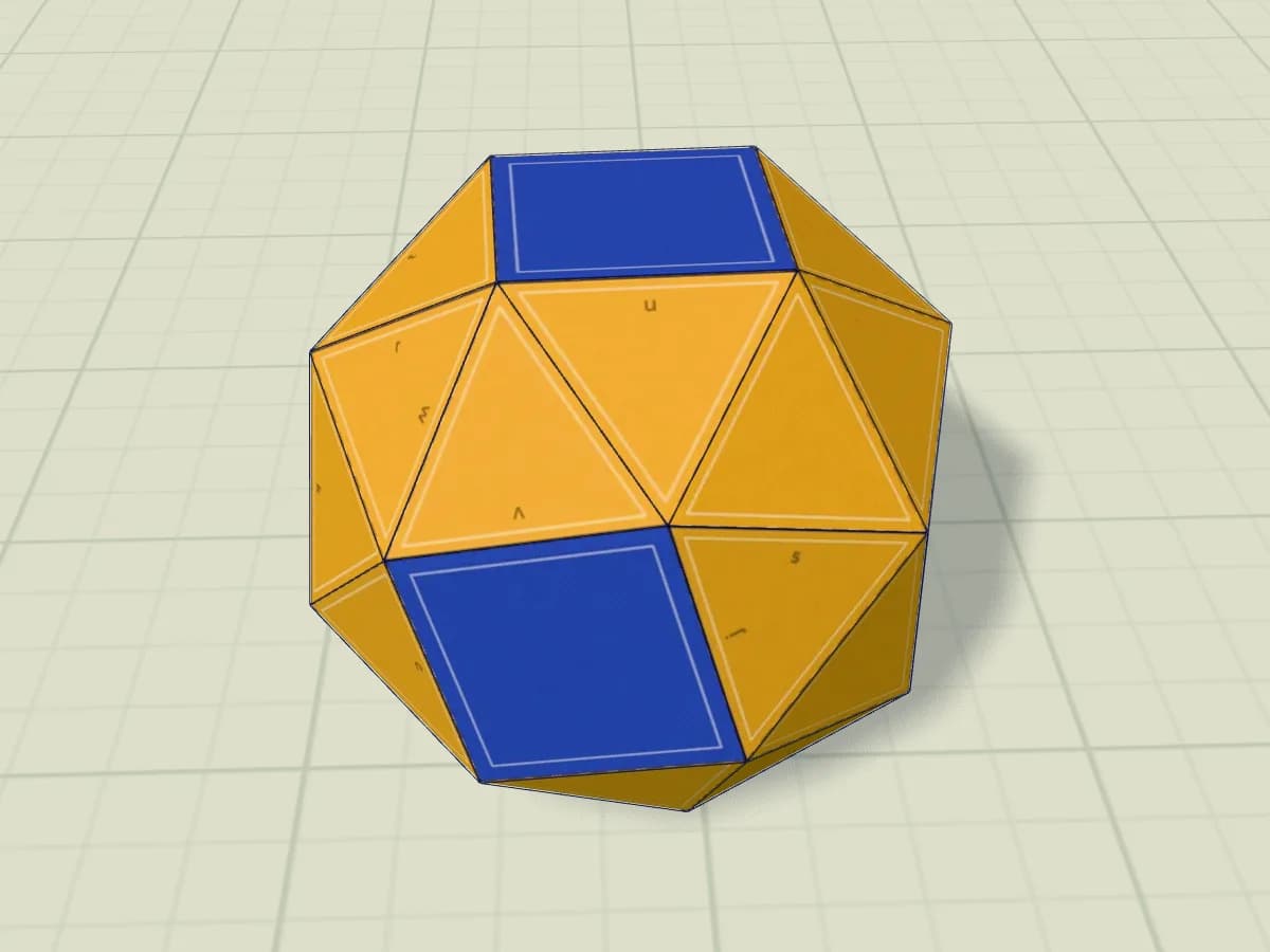 Cube adouci en papier assemblé, composé de triangles et de quadrilatères