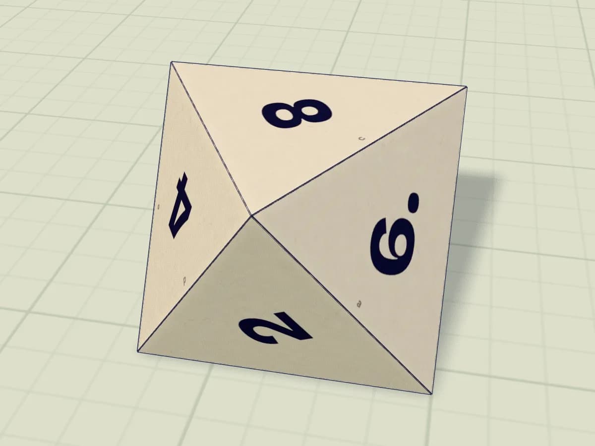 Dé en papier fermé, composé de huit faces triangulaires numérotées.