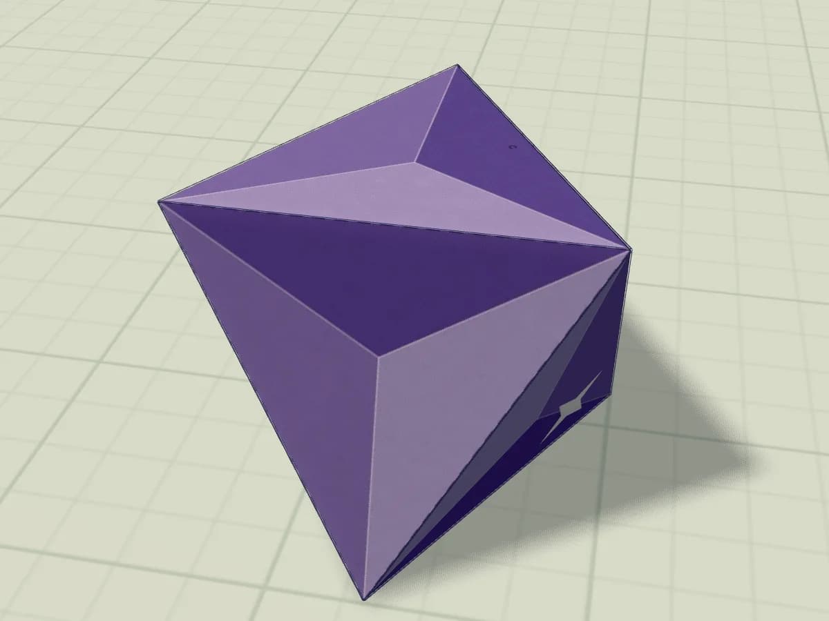 Octaèdre en papier terminé, présenté comme un cristal aux faces triangulaires