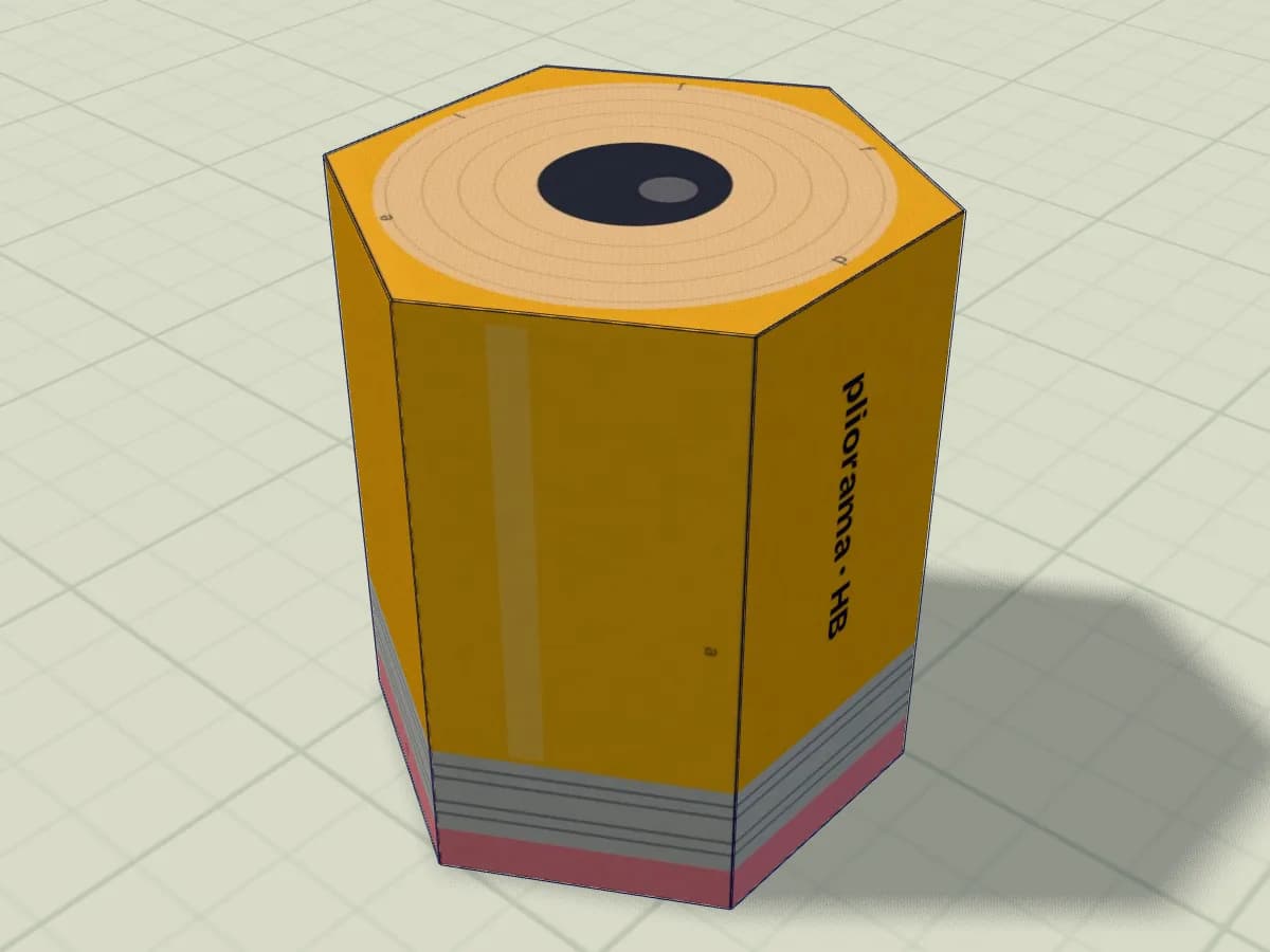Modèle de prisme hexagonal en papier représentant un crayon