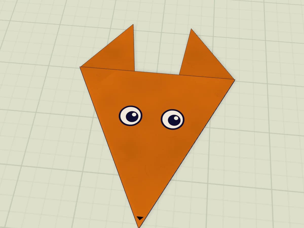 Modèle de renard en papier avec deux yeux et un petit nez noir