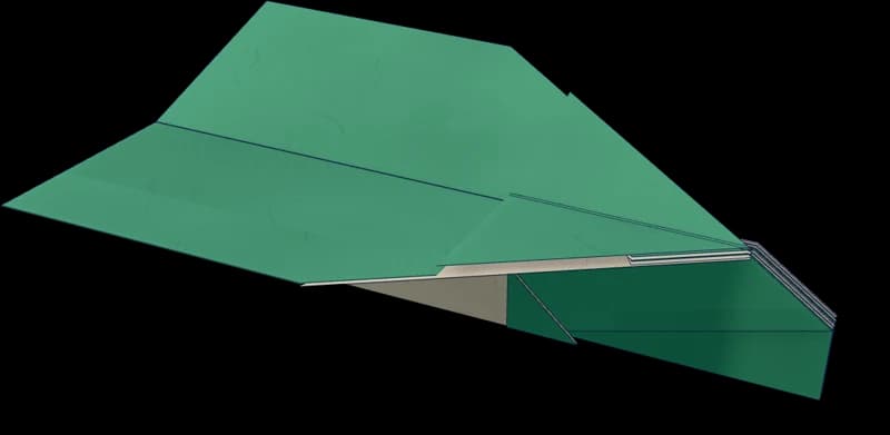 Planeur en papier aux ailes légèrement relevées et au nez verrouillé