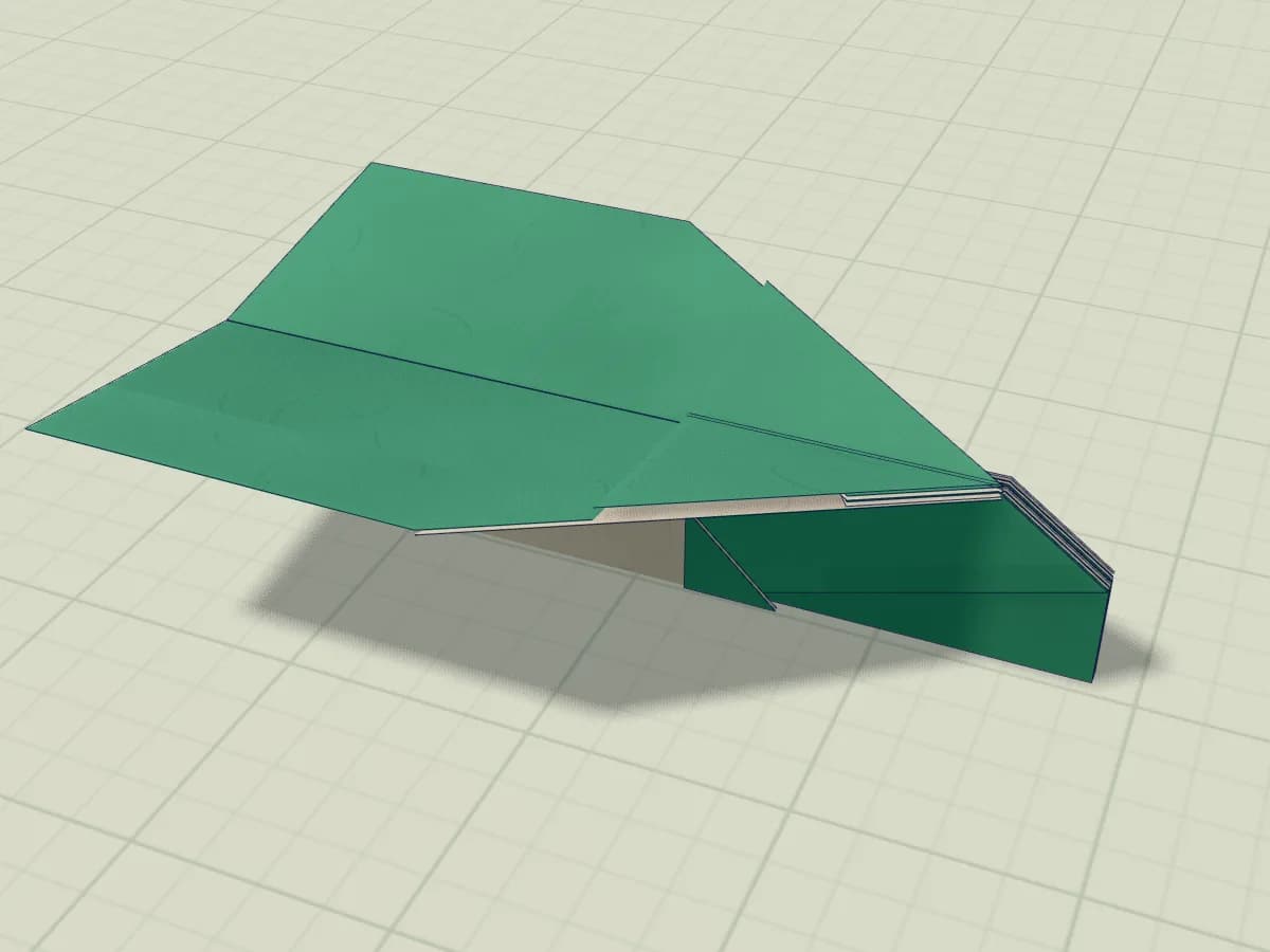 Planeur en papier aux ailes légèrement relevées et au nez verrouillé