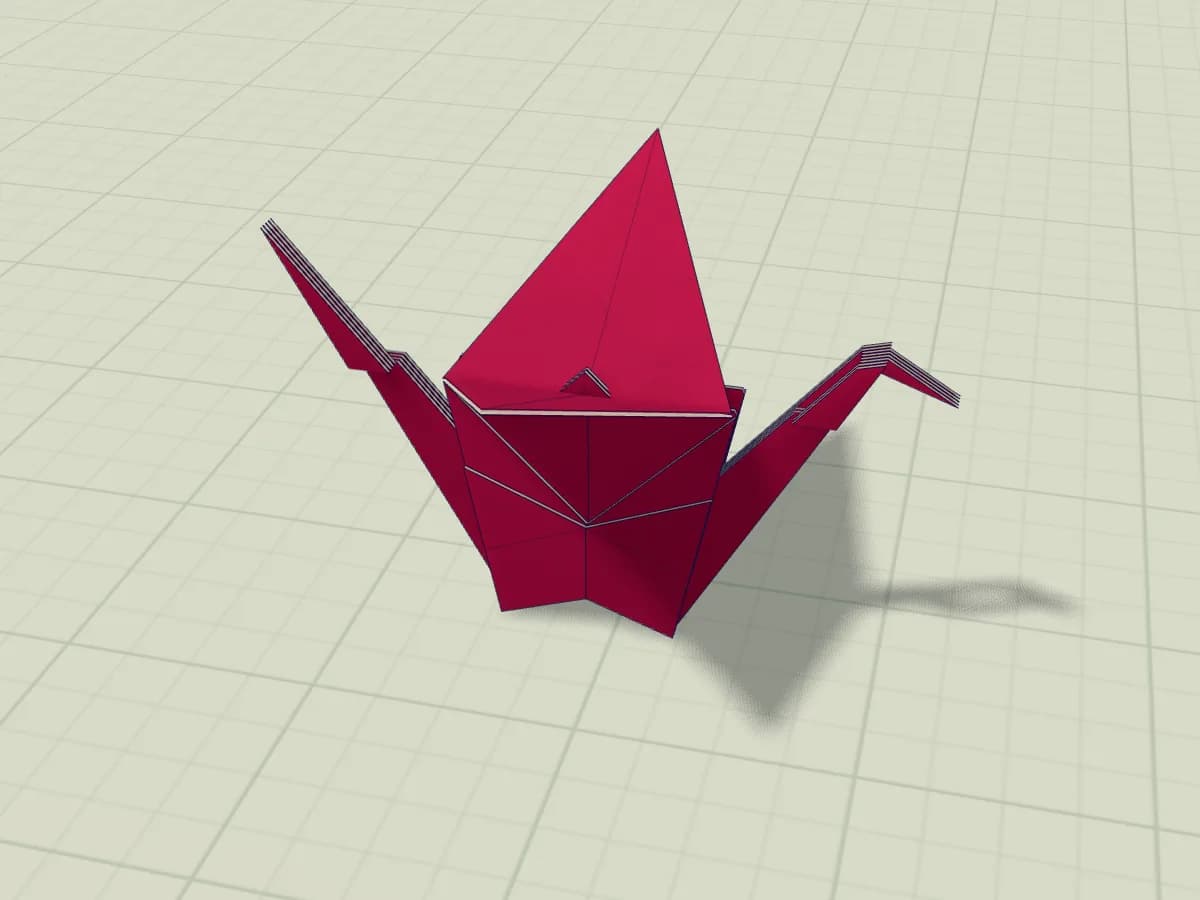 Grue en papier aux ailes ouvertes, avec un cou et une queue pointus